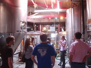 Historic Preservation students tour a former car dealership in Winston-Salem, now home to Foothills Brewery.